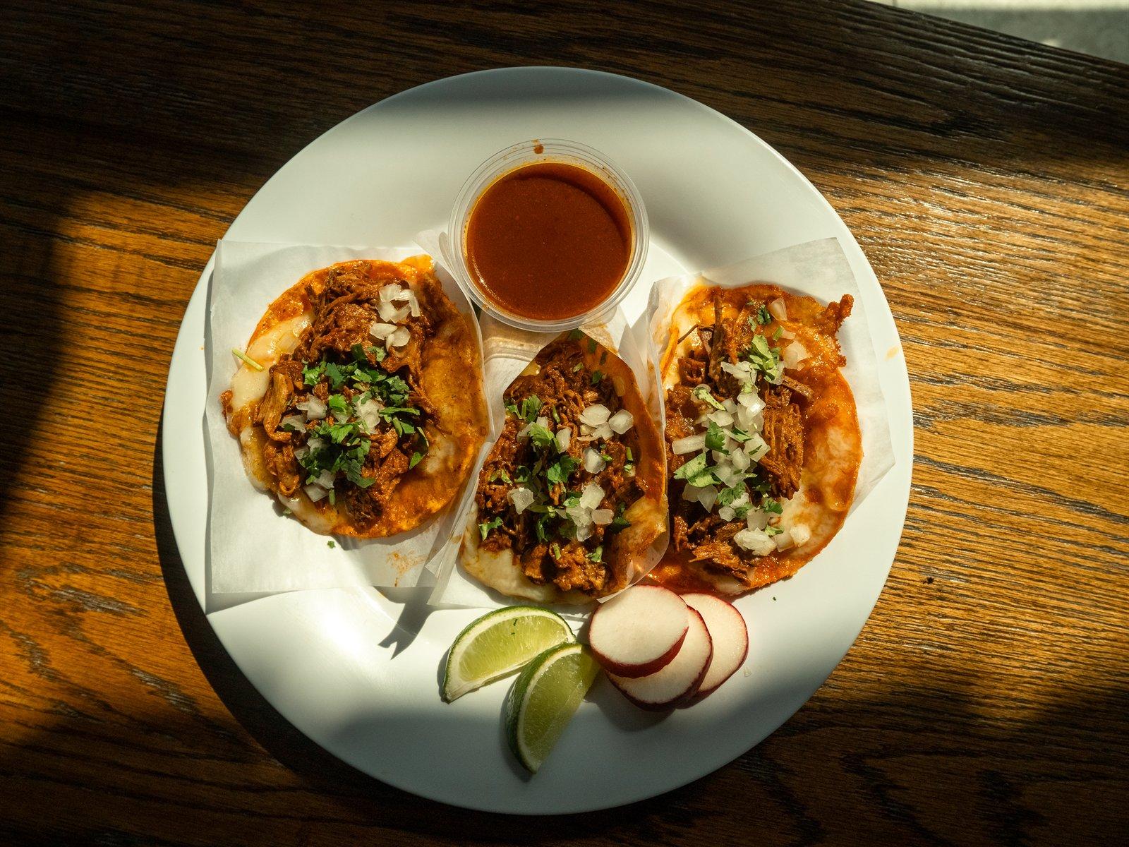 Red birria queso tacos with consommé cup