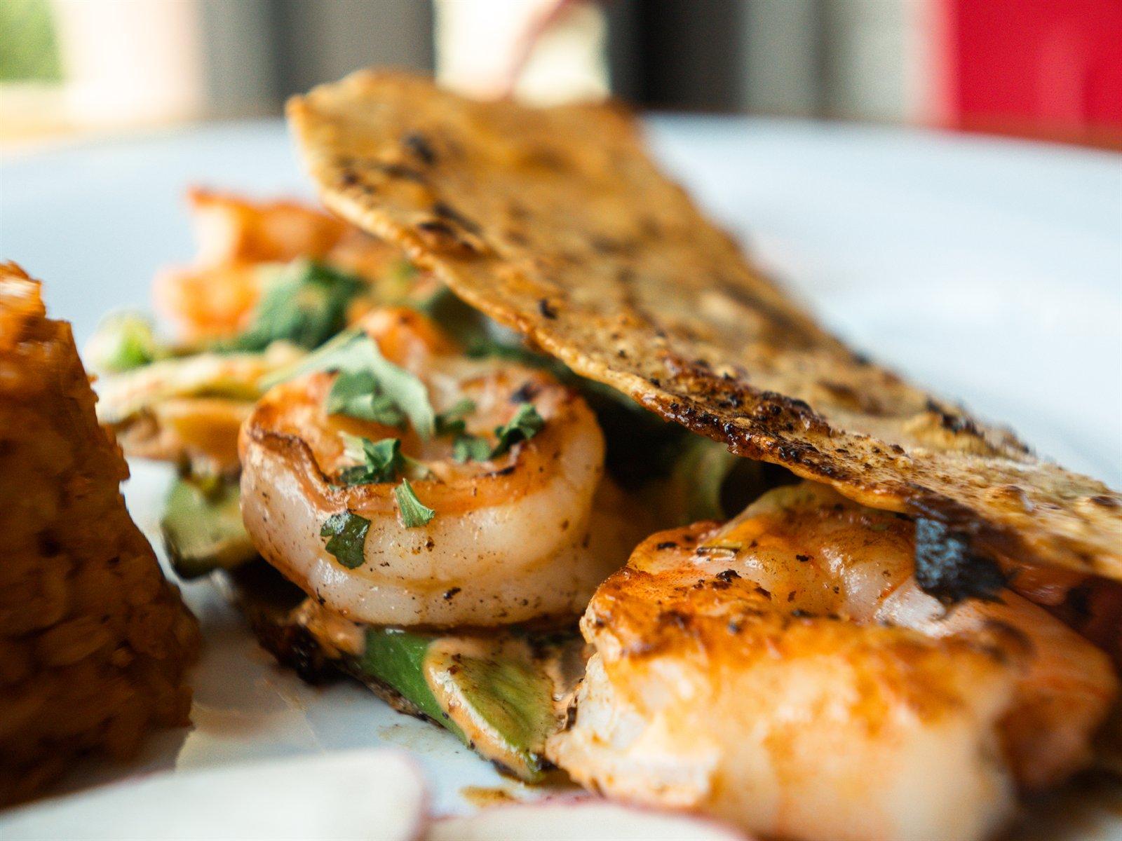 Griddled shrimp quesadilla lifted open